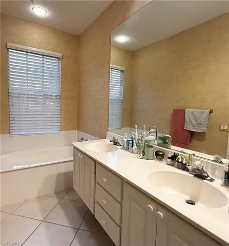 MASTER BATHROOM DOUBLE SINK & ROMAN BATHTUB VIEW