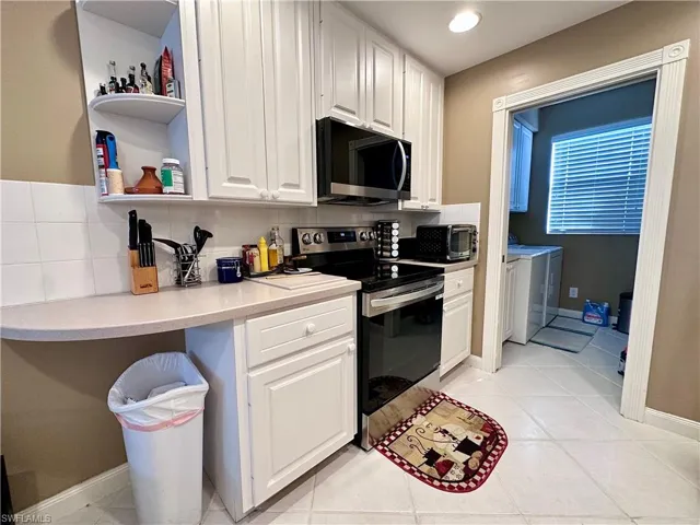 KITCHEN NEW SS APPLIANCES (CORIAN COUNTERTOPS)