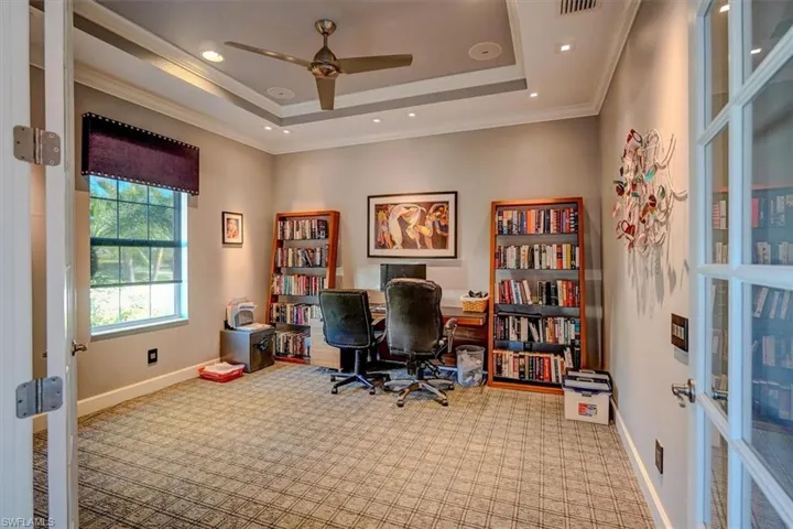 Office featuring french doors, crown molding, carpet flooring, a raised ceiling, and ceiling fan