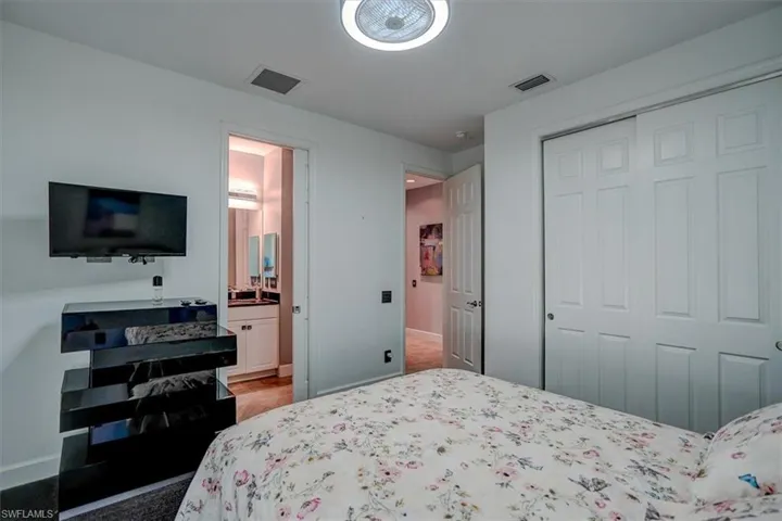 Bedroom with a closet and ensuite bathroom