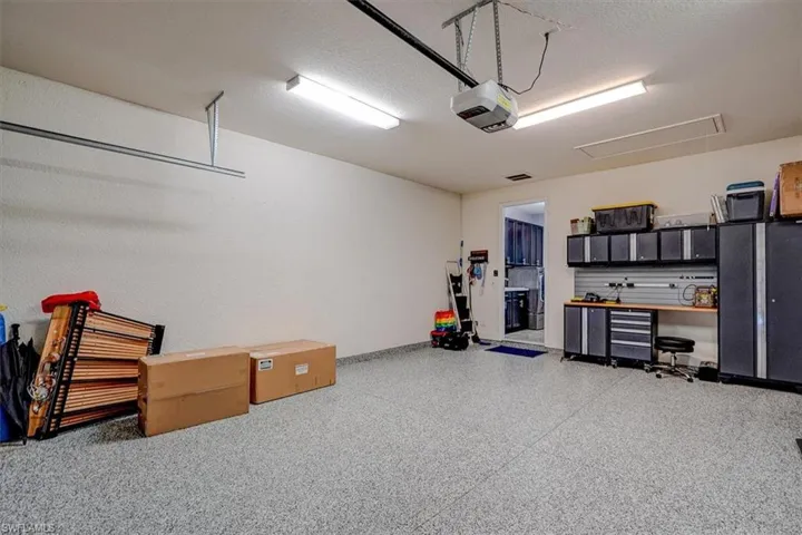 Garage high end epoxy floor and workbench and cabinets