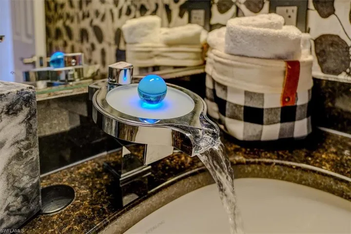 Half bath faucet that changes to red when water is hot.