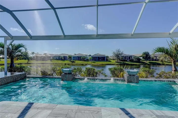 View of saltwater pool featuring a water view, pool water features
