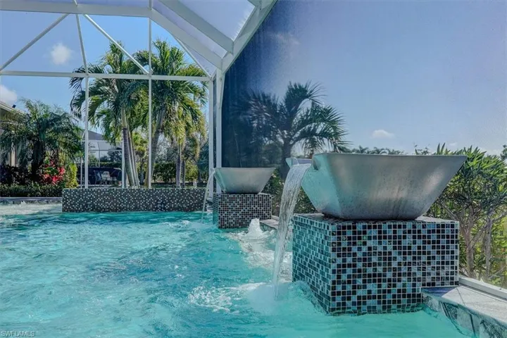 View of saltwater pool featuring pool water features
