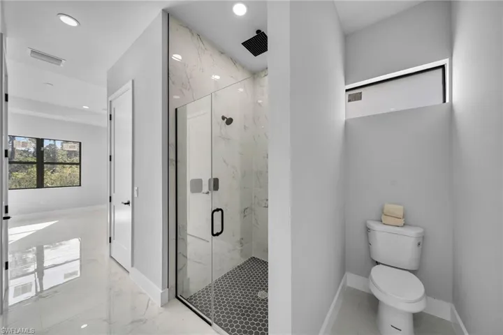 Bathroom featuring toilet and walk in shower