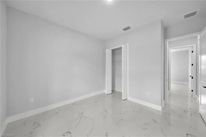 Unfurnished bedroom with a closet
