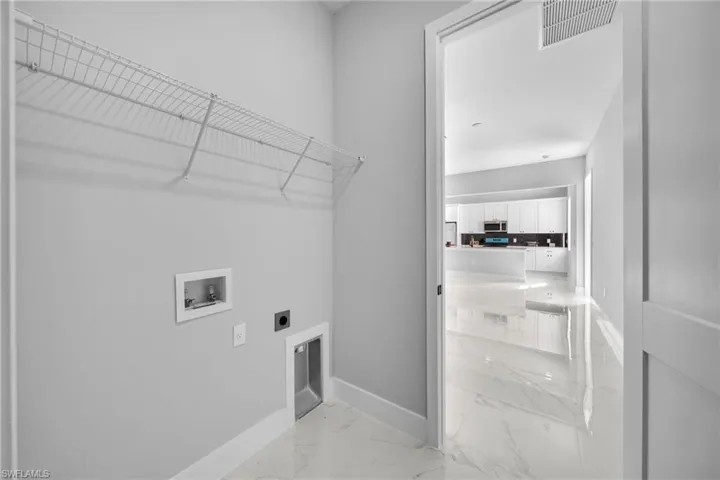 Laundry room with washer hookup and electric dryer hookup
