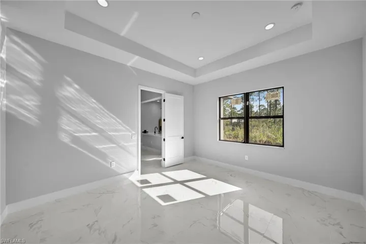 Empty room with a raised ceiling