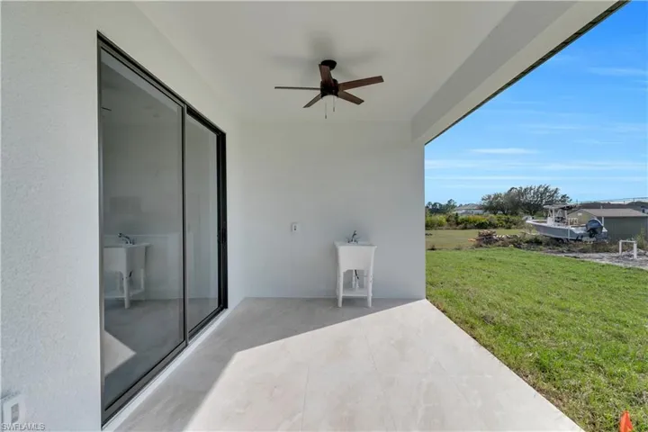 View of patio featuring a ceiling fan