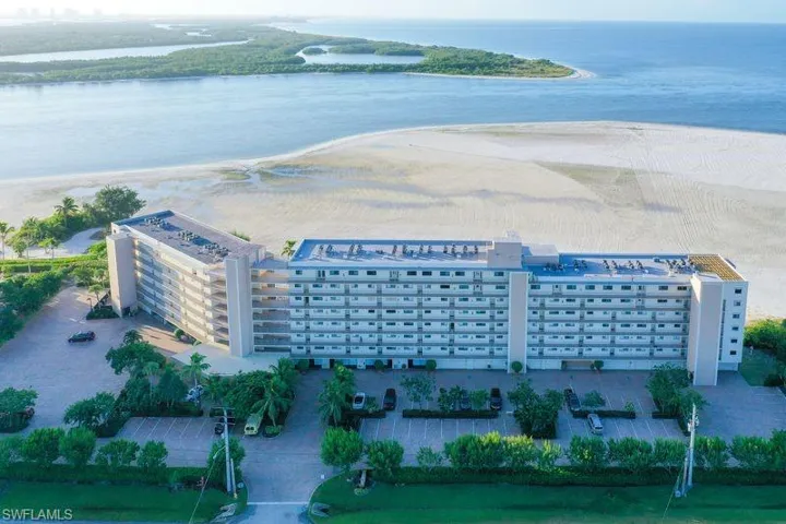 Wide sandy beachfront in front of condo