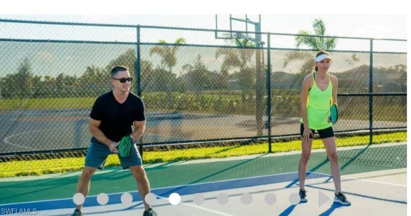 View of tennis court with community basketball court
