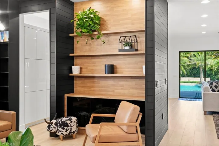 Living room featuring recessed lighting, light wood finished floors, and baseboards