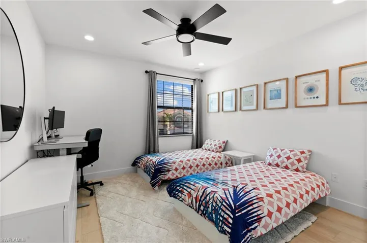 Bedroom featuring recessed lighting, light wood-style floors, baseboards, and ceiling fan