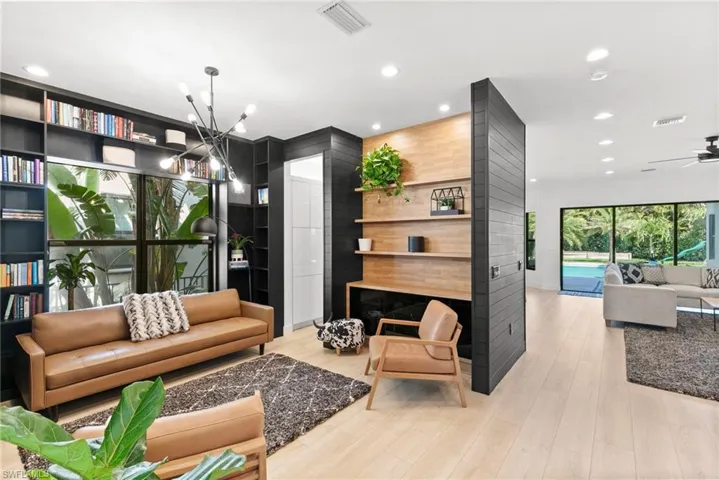 Living area featuring recessed lighting and visible vents