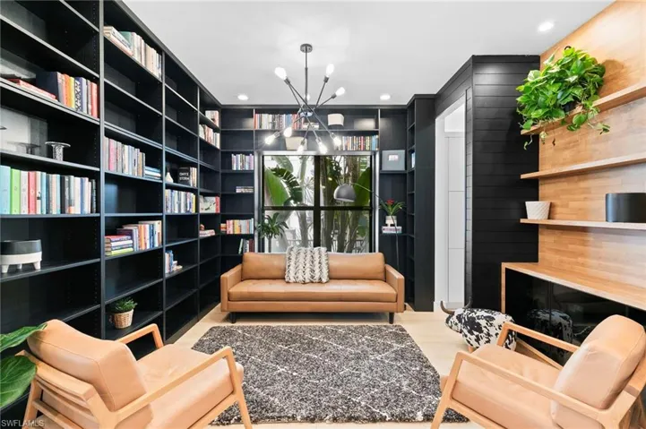 Sitting room featuring recessed lighting and an inviting chandelier