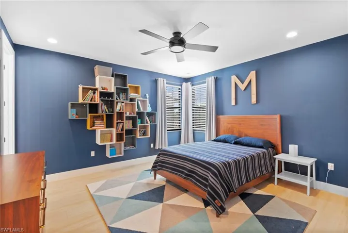 Bedroom with recessed lighting, ceiling fan, and wood finished floors