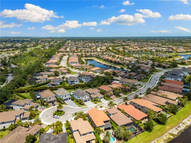 Birds eye view of property with a residential view and a water view