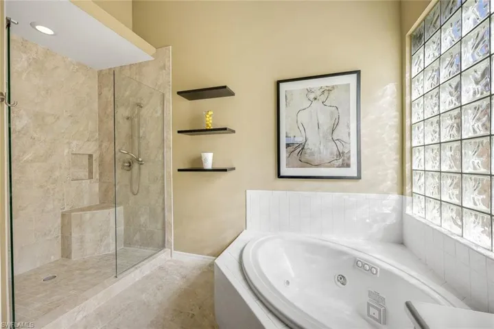 Ensuite primary bathroom has been tastefully updated featuring a walk-in shower.