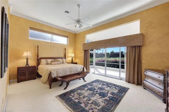 Stunning primary bedroom suite with lake and golf course views!