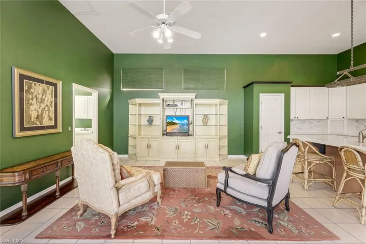 Living room features vaulted ceilings and so much natural light.