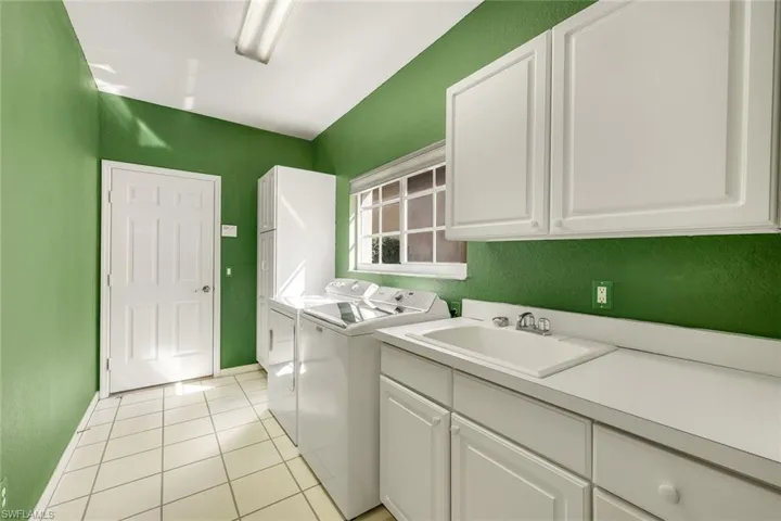Spacious laundry room is located just off the main living area offering plenty of additional storage.