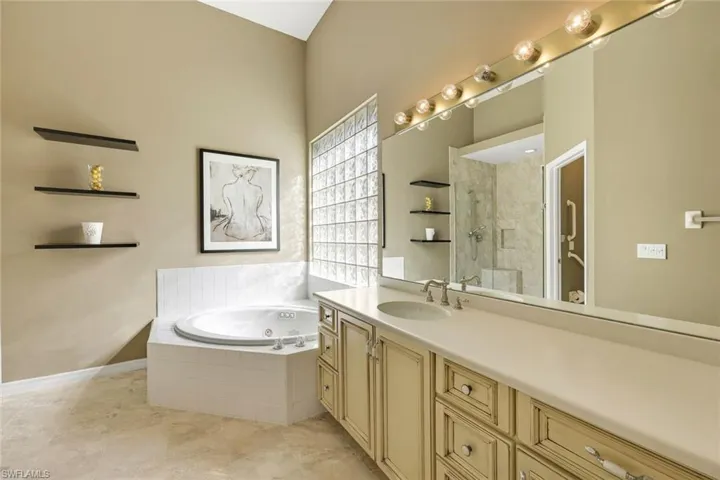 Primary bathroom features dual sinks and soaking tub.
