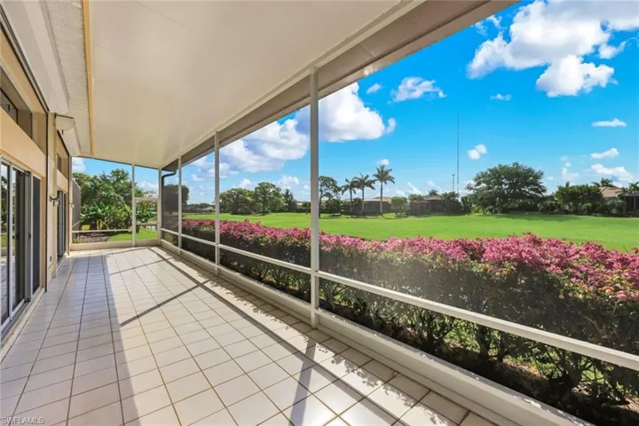 This HUGE lanai offers SO much privacy AND stunning lake and golf course views!
