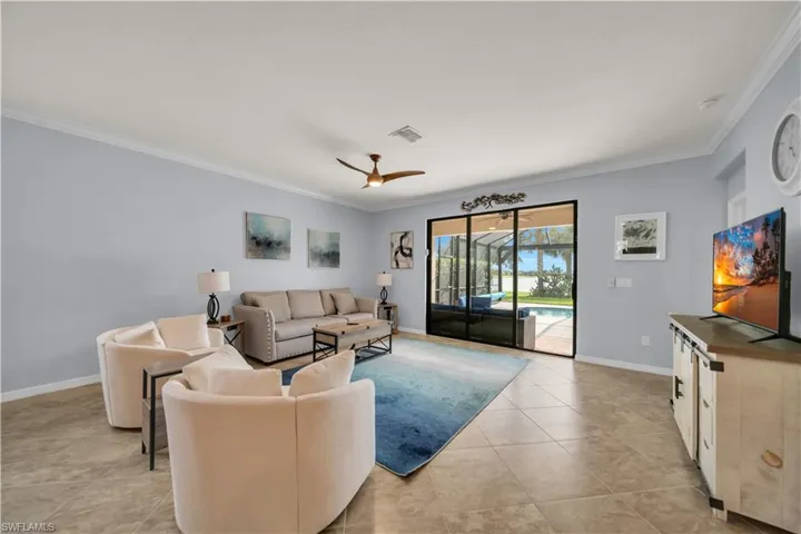 Crown molding, tile flooring, and a ceiling fan with integrated lighting