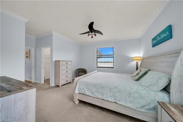 Recessed lighting, crown molding, wall-to-wall carpeting, and a ceiling fan