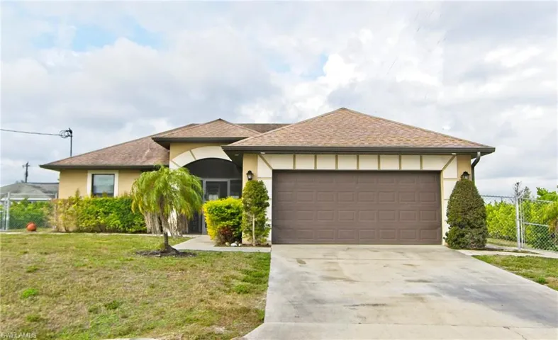 Ranch-style house with stucco siding, roof with shingles, concrete driveway, and a garage