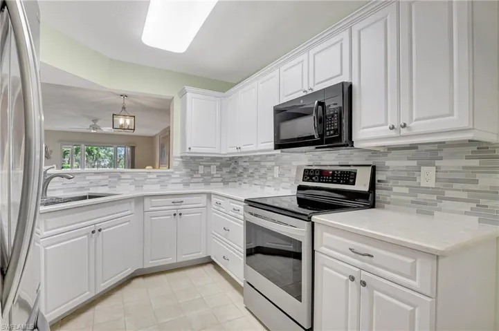 Kitchen with SS Appliances and Tile Back Splash