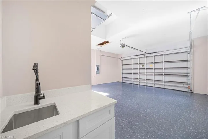 Garage featuring a sink