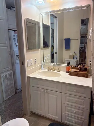 Bathroom with vanity and light tile patterned flooring