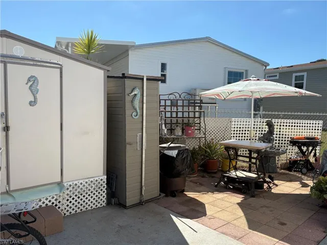View of patio with large shed.
