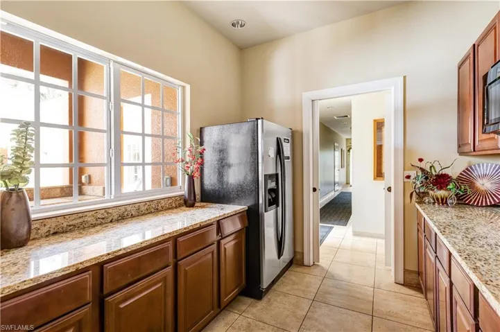 Sauna with tile patterned flooring and wooden ceiling