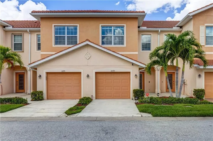 Mediterranean / spanish-style house featuring a tile roof, an attached garage, driveway, and stucco siding