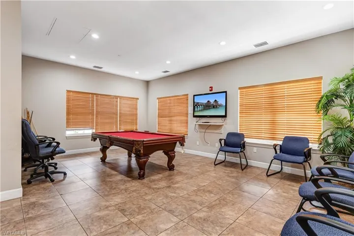 Lobby featuring beamed ceiling, coffered ceiling, and a high ceiling