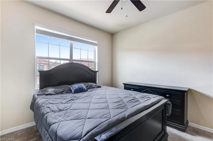 Bedroom featuring carpet floors and ceiling fan