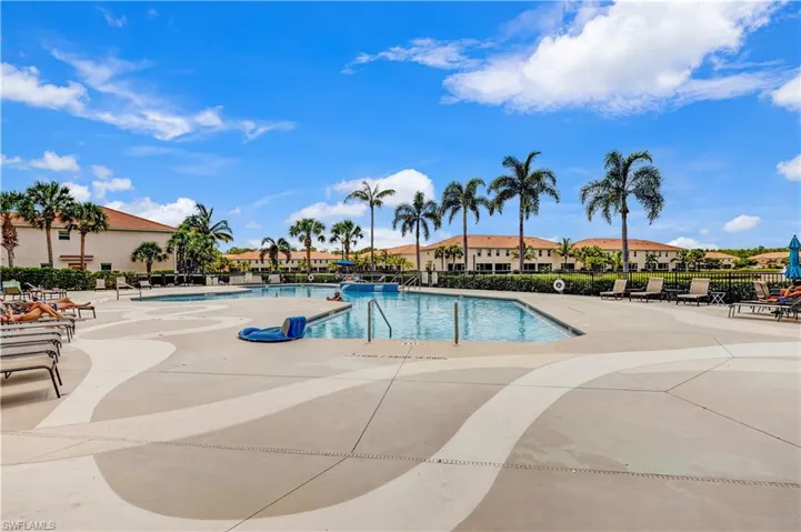 Community pool featuring a patio