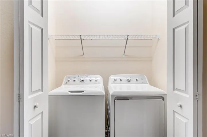 Laundry room featuring washing machine and dryer