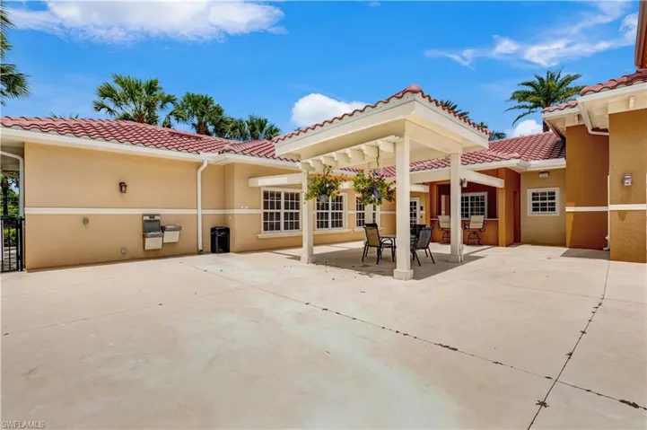 Community pool featuring a patio and a residential view