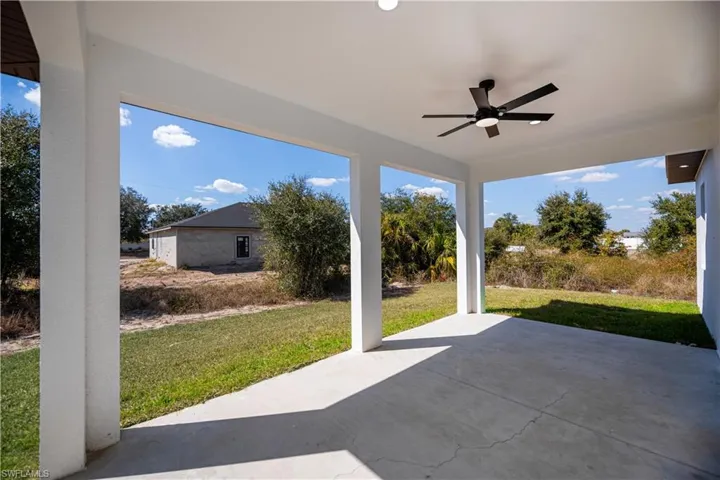 View of patio featuring ceiling fan
