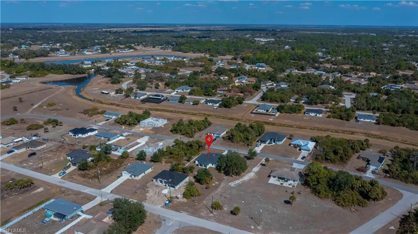 Aerial overview of property's location with nearby suburban area