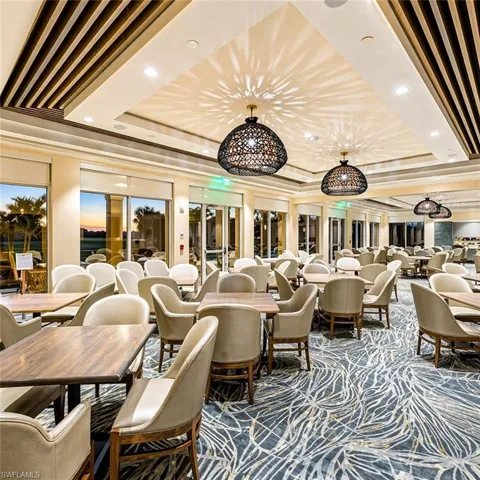 Elegant clubhouse dining with designer finishes and panoramic golf course views—perfect for social gatherings and upscale everyday living.