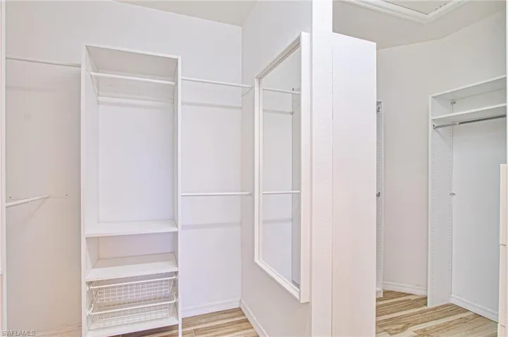 Primary Walk-in Closet w/custom organizers already installed!