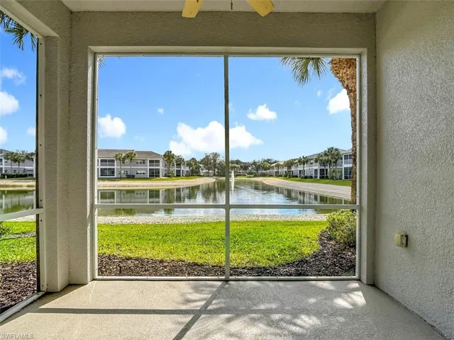 Unfurnished sunroom with a water view and plenty of natural light