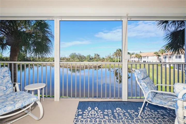 Unfurnished sunroom featuring a water view and a healthy amount of sunlight
