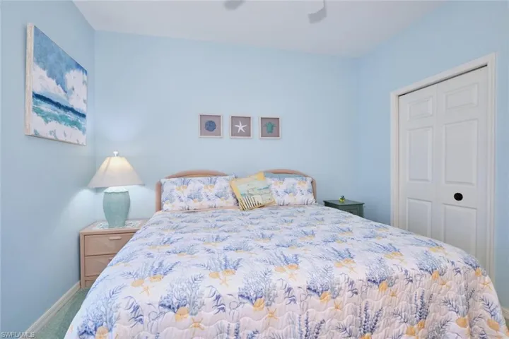 Bedroom featuring ceiling fan, a closet, and carpet floors