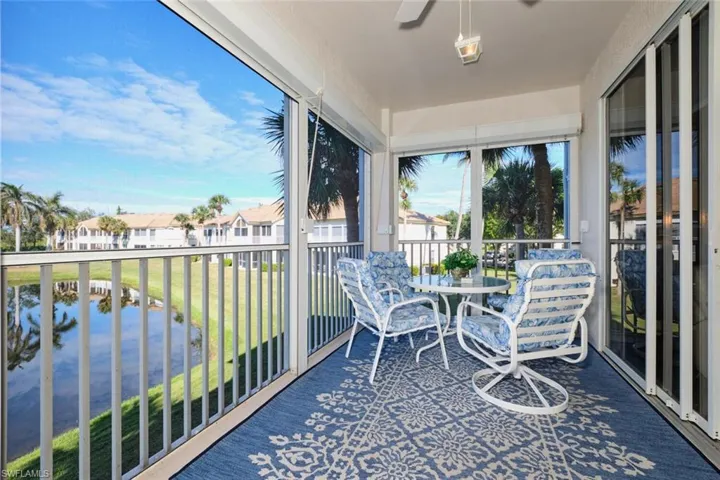 Sunroom / solarium with a water view