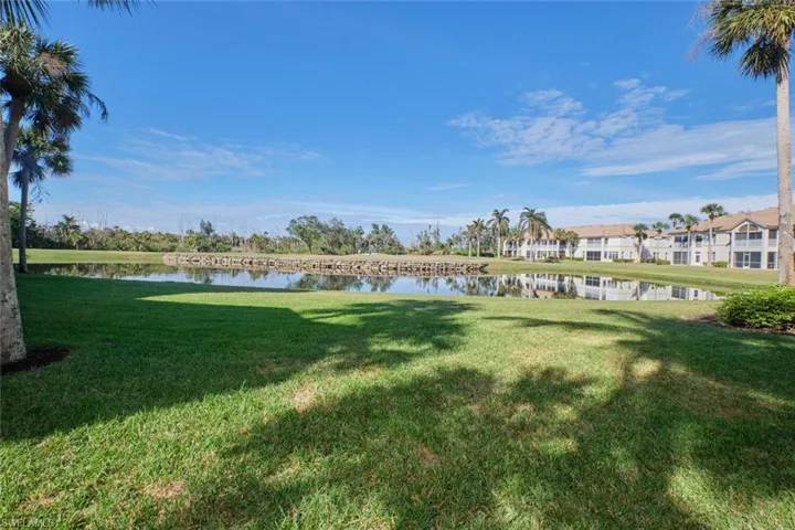 View of yard with a water view